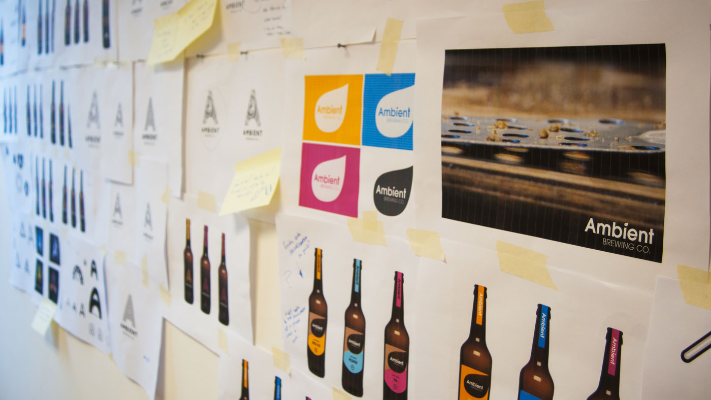 Photograph showing ambient design concepts pinned up on studio wall