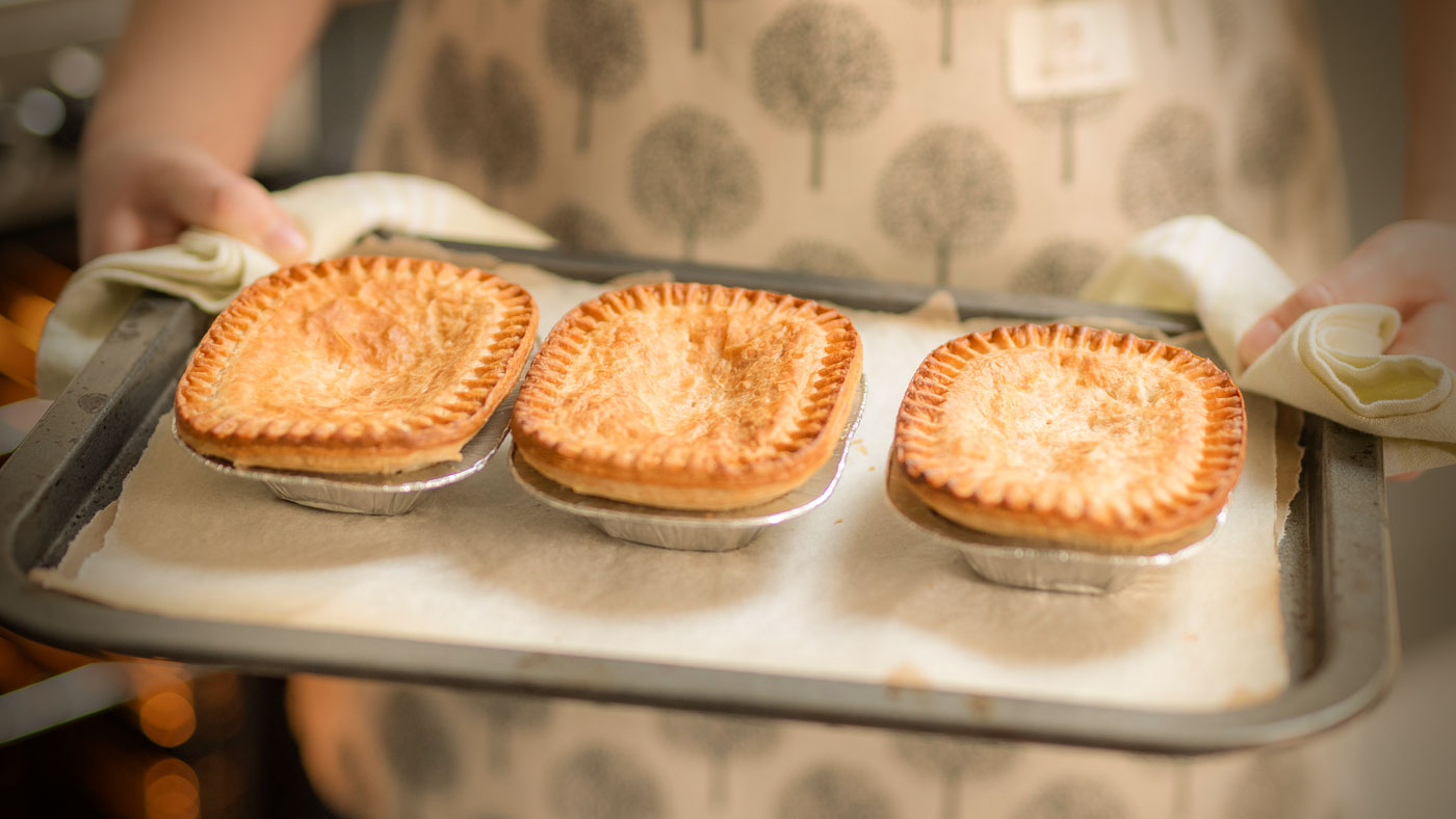An image of cooked pies on an oven tray